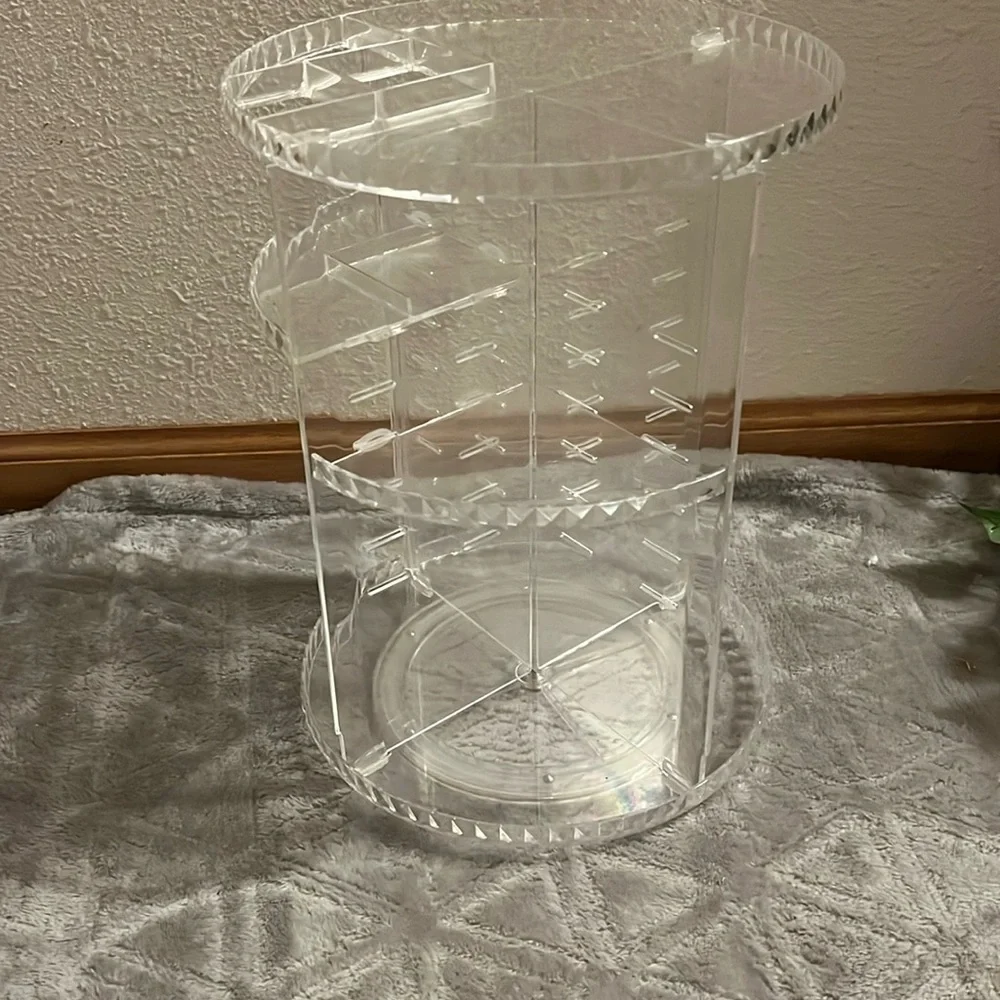 360° spinning skincare/makeup organizer. clear plastic.
